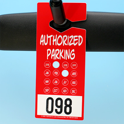 Punch Tag on rear view mirror w/ sample punched out Punch Tag on rear view mirror w/ sample punched out
